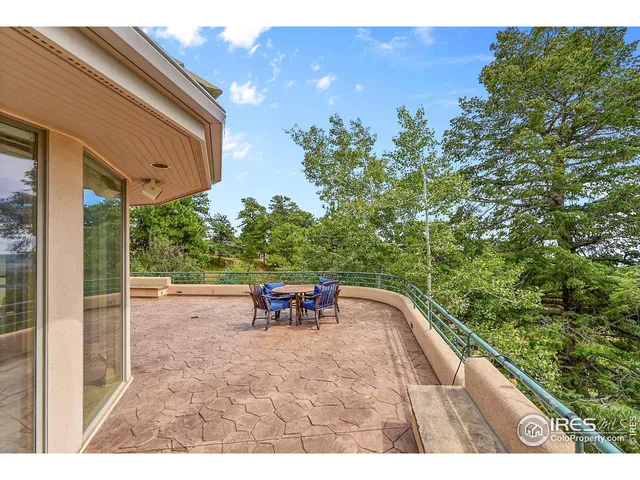 a view of a backyard with sitting area