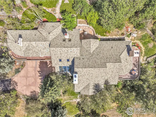 aerial view of a house with a yard