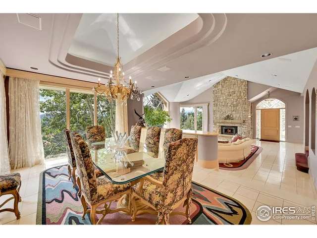 a view of a dining room with furniture wooden floor and chandelier