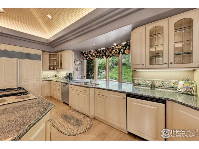 a kitchen with sink cabinets and stove