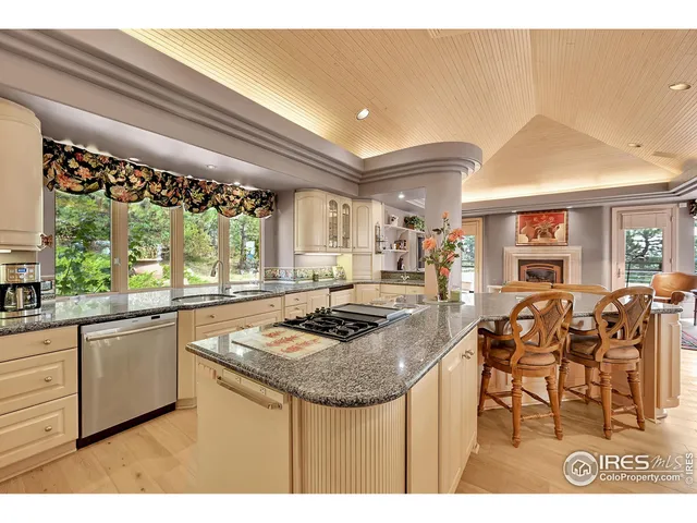 a kitchen with stainless steel appliances granite countertop a stove and a sink