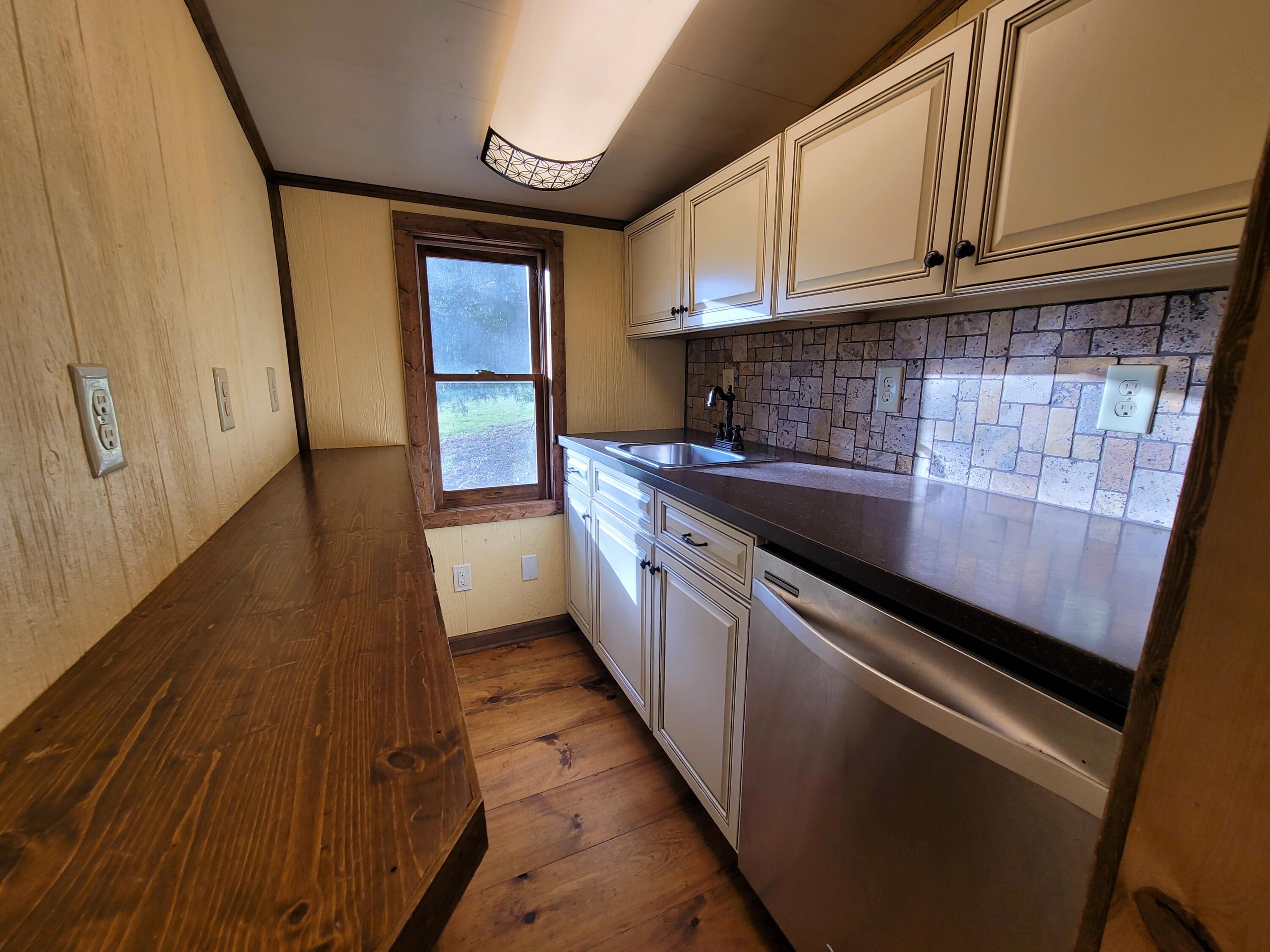 330 Green Level Road Boones Mill, VA 24065 - Photo 13 of 43 a kitchen with a sink and cabinets