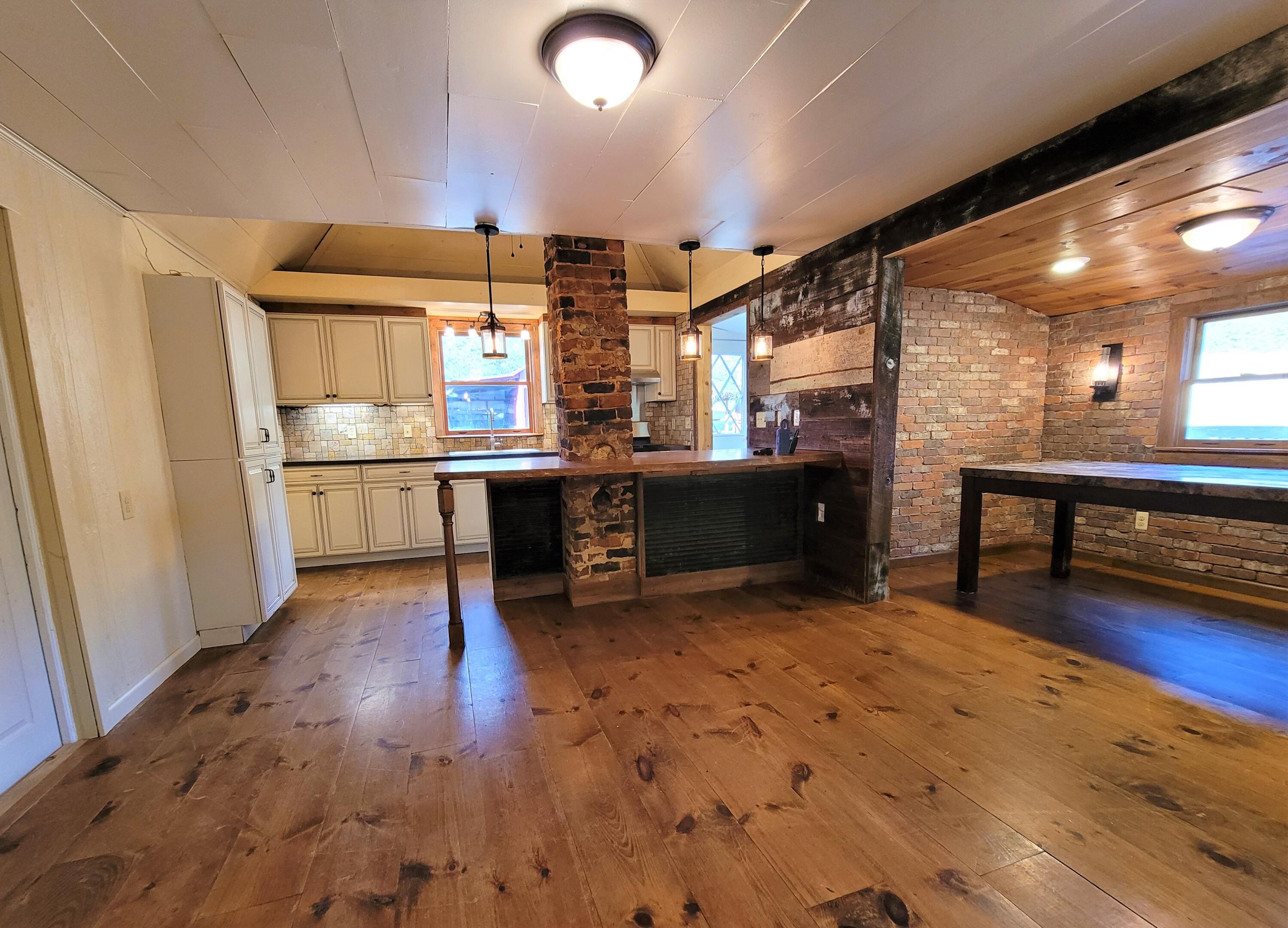 330 Green Level Road Boones Mill, VA 24065 - Photo 24 of 43 a view of a kitchen with a sink and a refrigerator