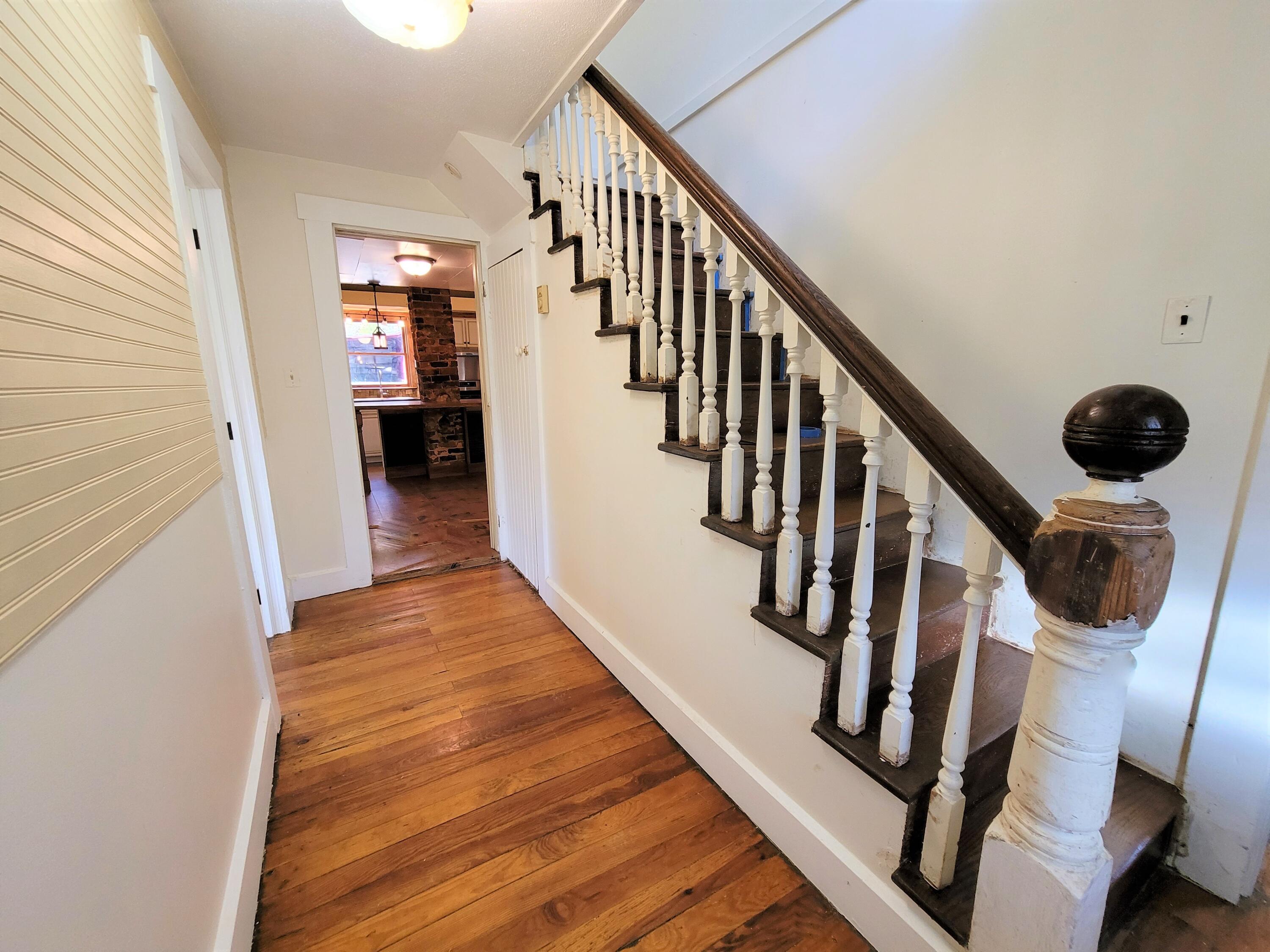 330 Green Level Road Boones Mill, VA 24065 - Photo 25 of 43 a view of a hallway with wooden floor and staircase