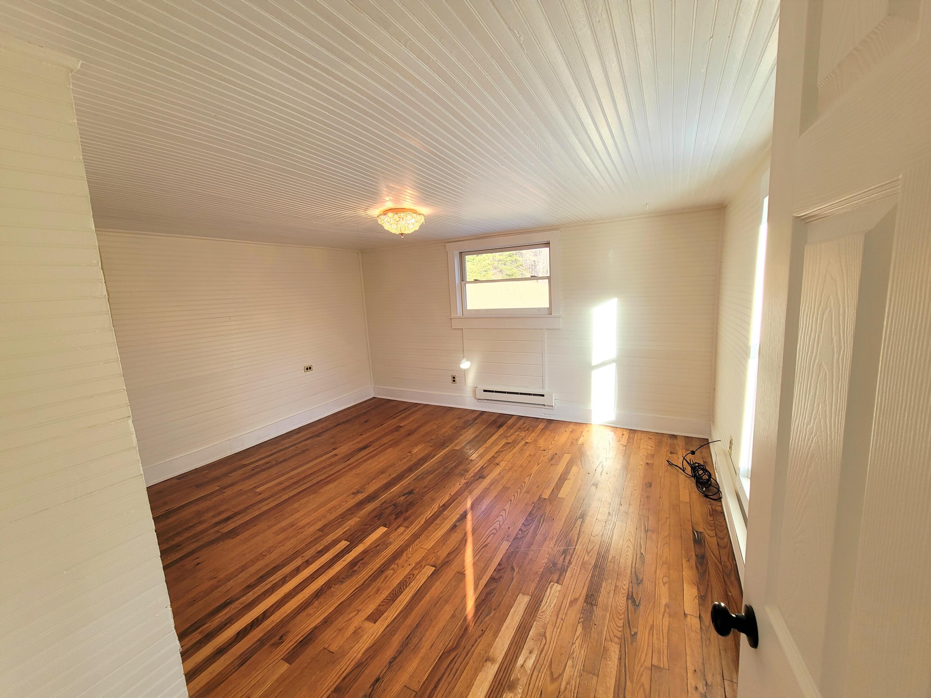 330 Green Level Road Boones Mill, VA 24065 - Photo 27 of 43 a view of empty room with wooden floor