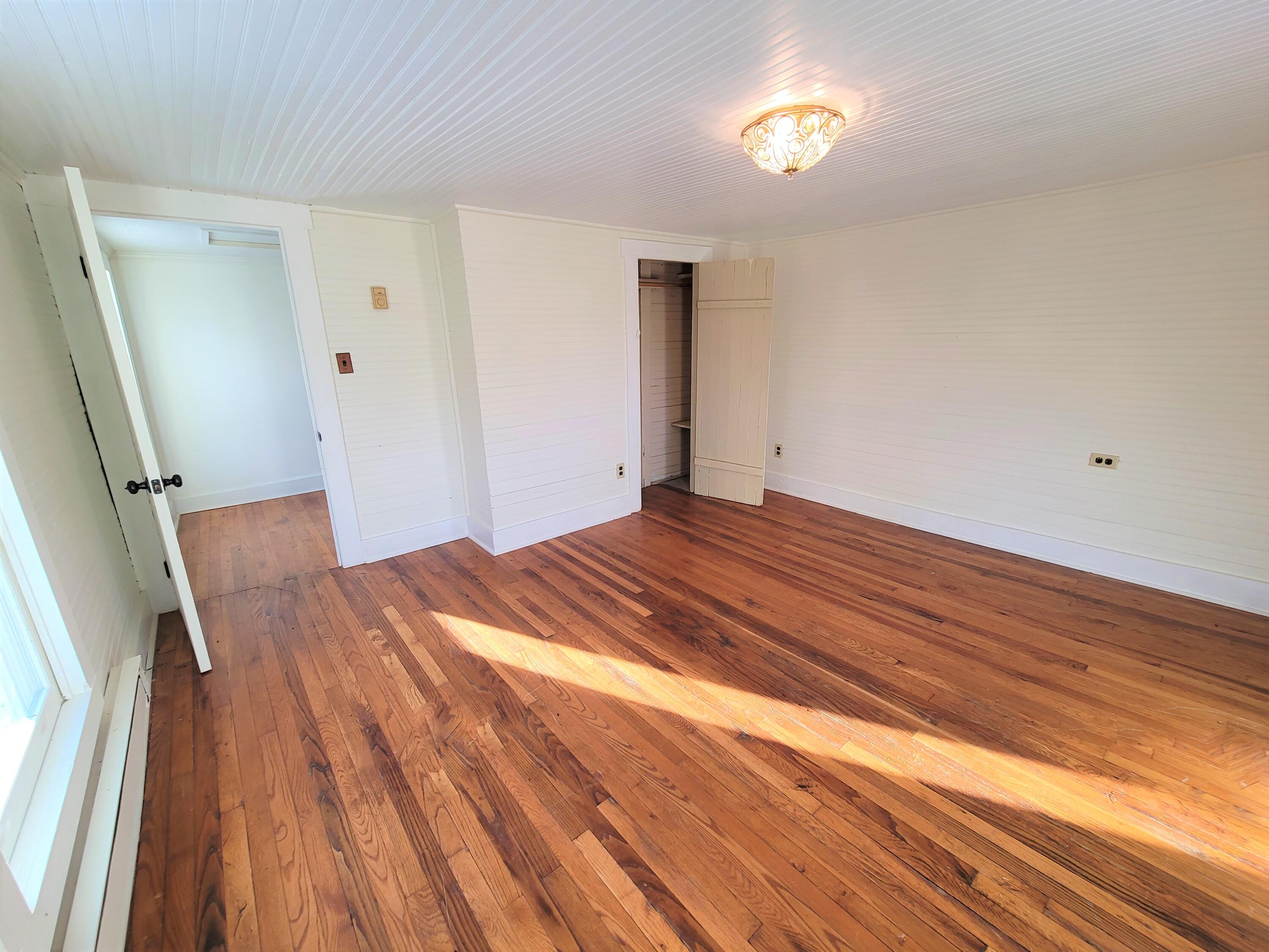 330 Green Level Road Boones Mill, VA 24065 - Photo 28 of 43 a view of empty room with wooden floor