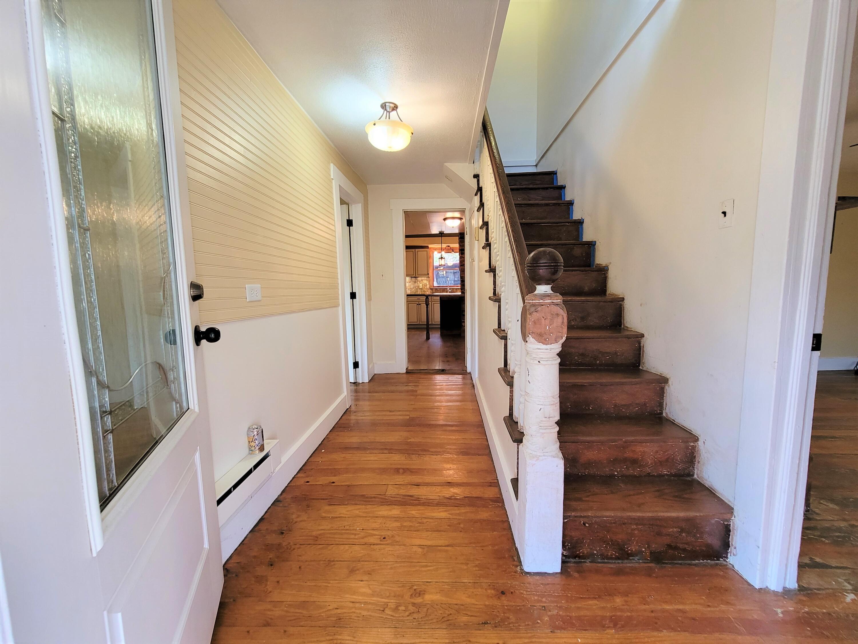 330 Green Level Road Boones Mill, VA 24065 - Photo 30 of 43 a view of a hallway with wooden floor and stairs