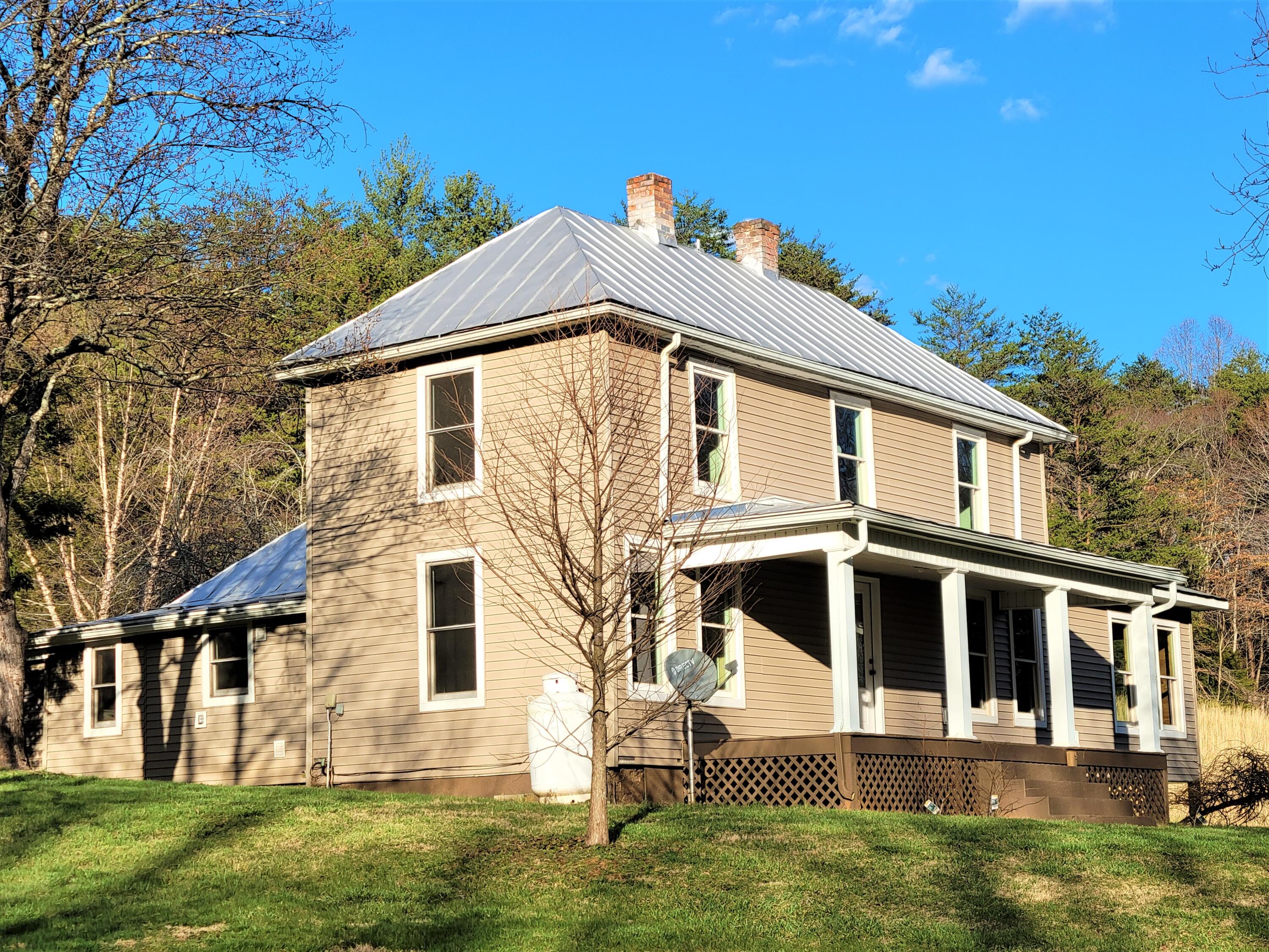 330 Green Level Road Boones Mill, VA 24065 - Photo 3 of 43 a front view of a house with a yard