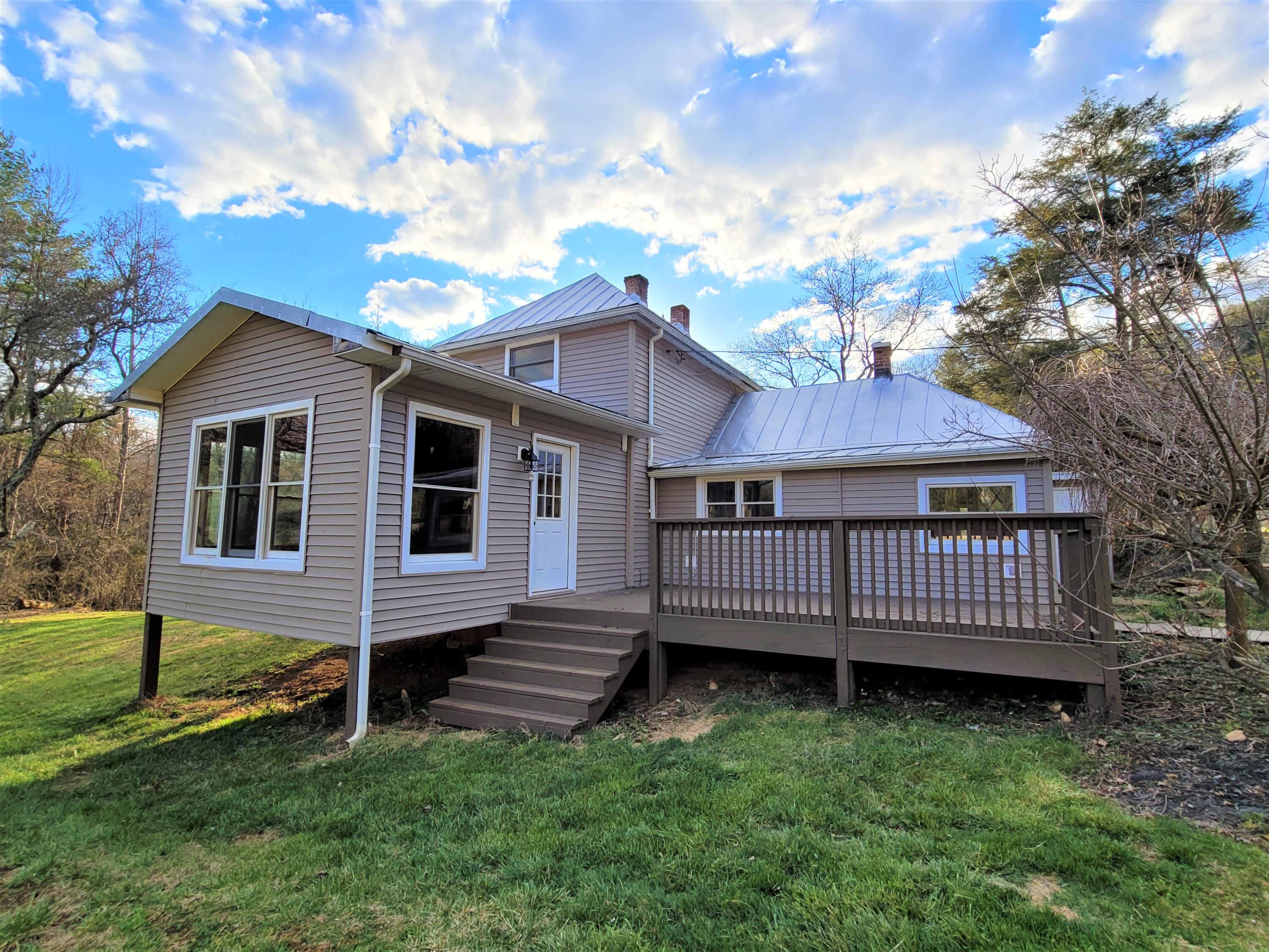 330 Green Level Road Boones Mill, VA 24065 - Photo 4 of 43 a view of a house with a yard