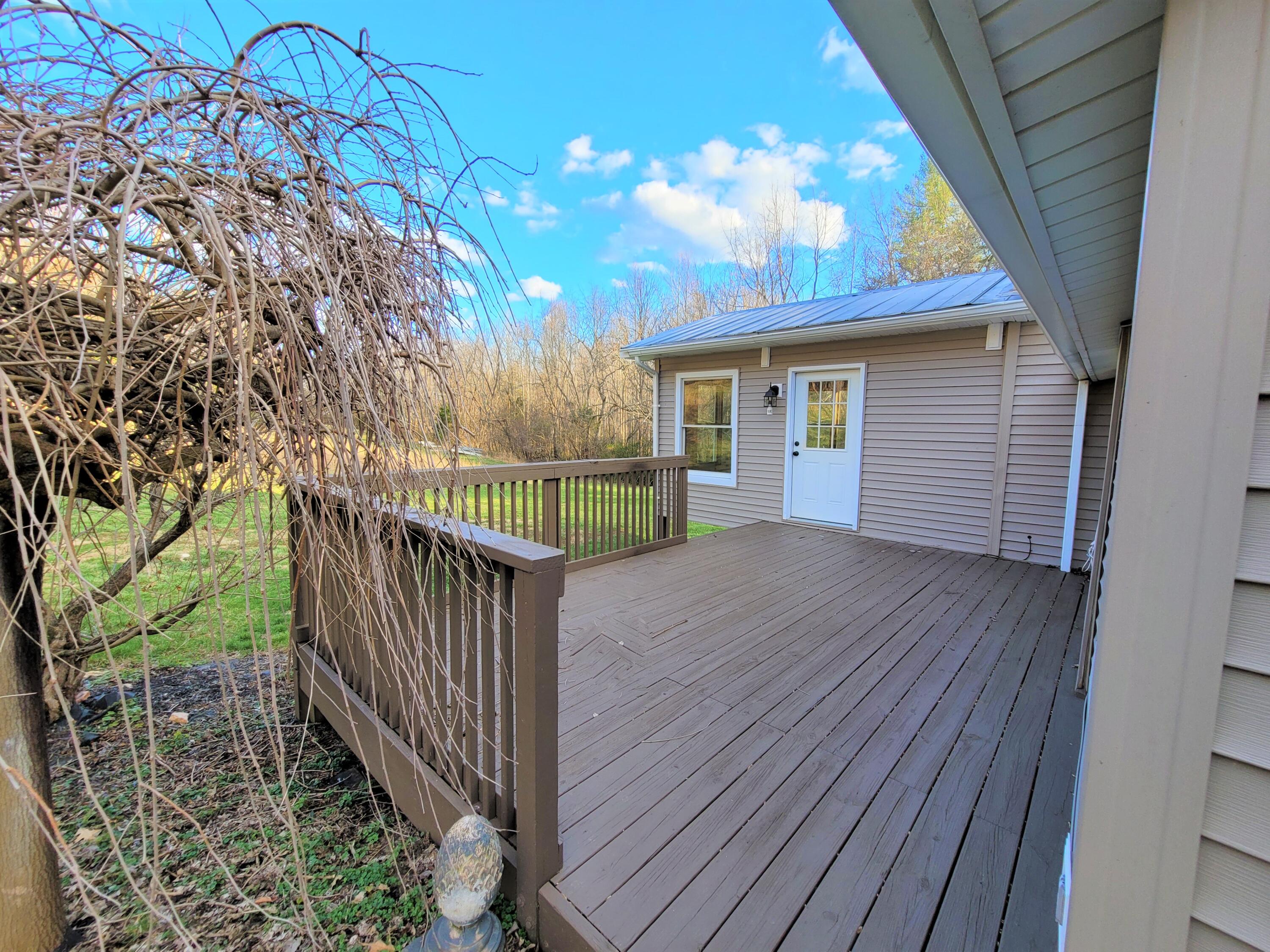 330 Green Level Road Boones Mill, VA 24065 - Photo 6 of 43 a view of backyard with deck and wooden floor