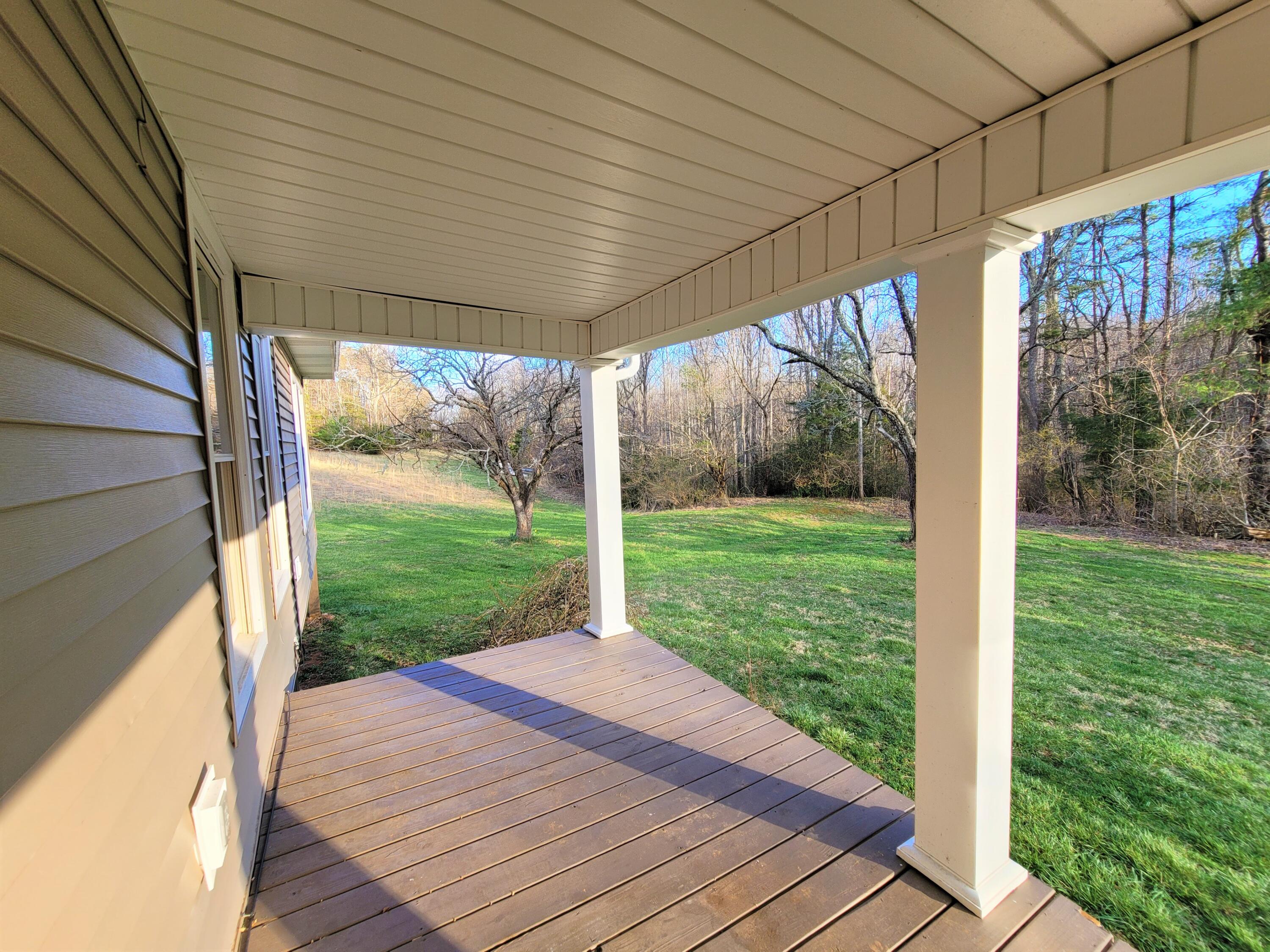 330 Green Level Road Boones Mill, VA 24065 - Photo 7 of 43 a view of a porch with wooden floor and outdoor space