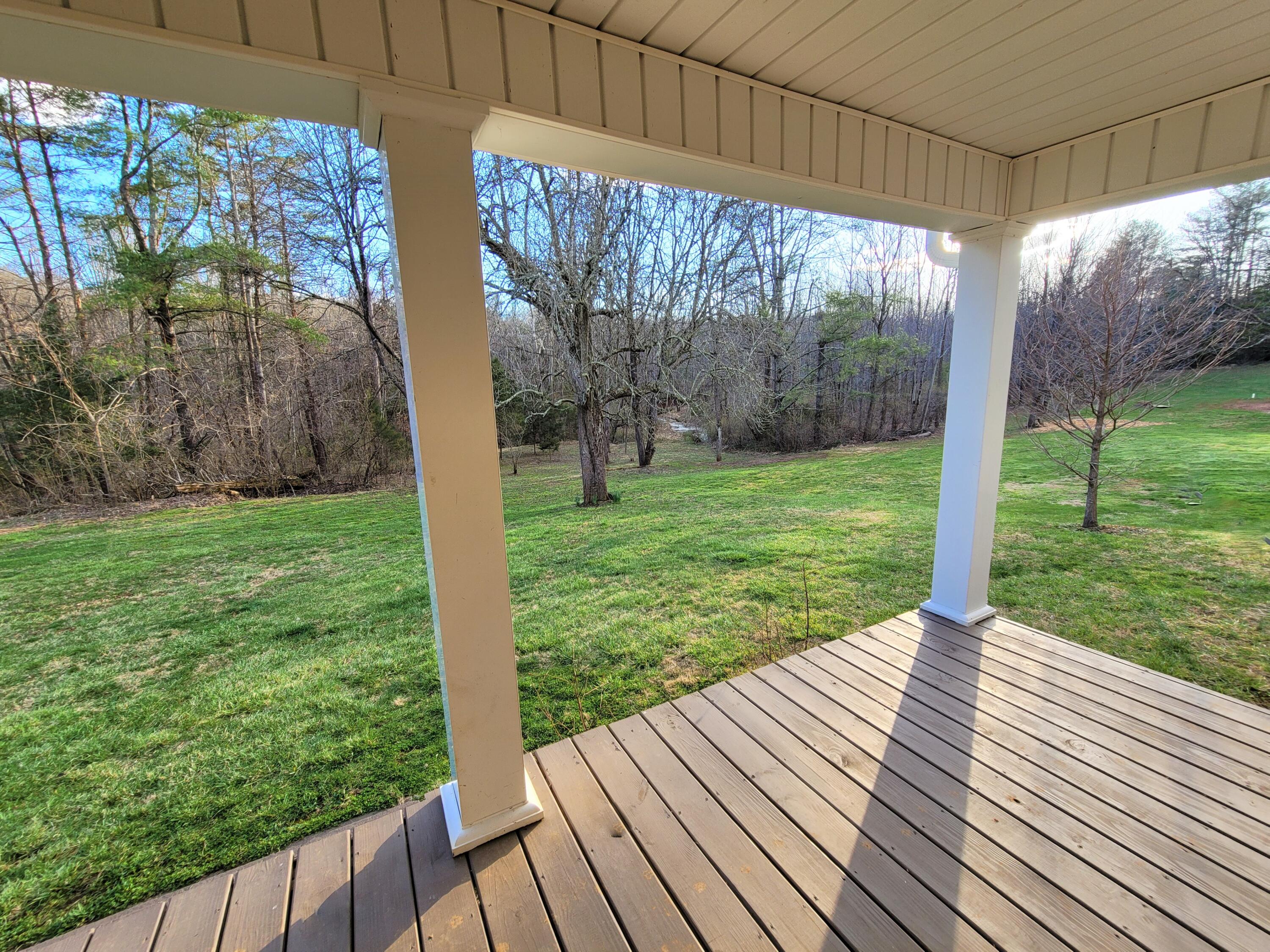 330 Green Level Road Boones Mill, VA 24065 - Photo 8 of 43 a view of a porch with a yard