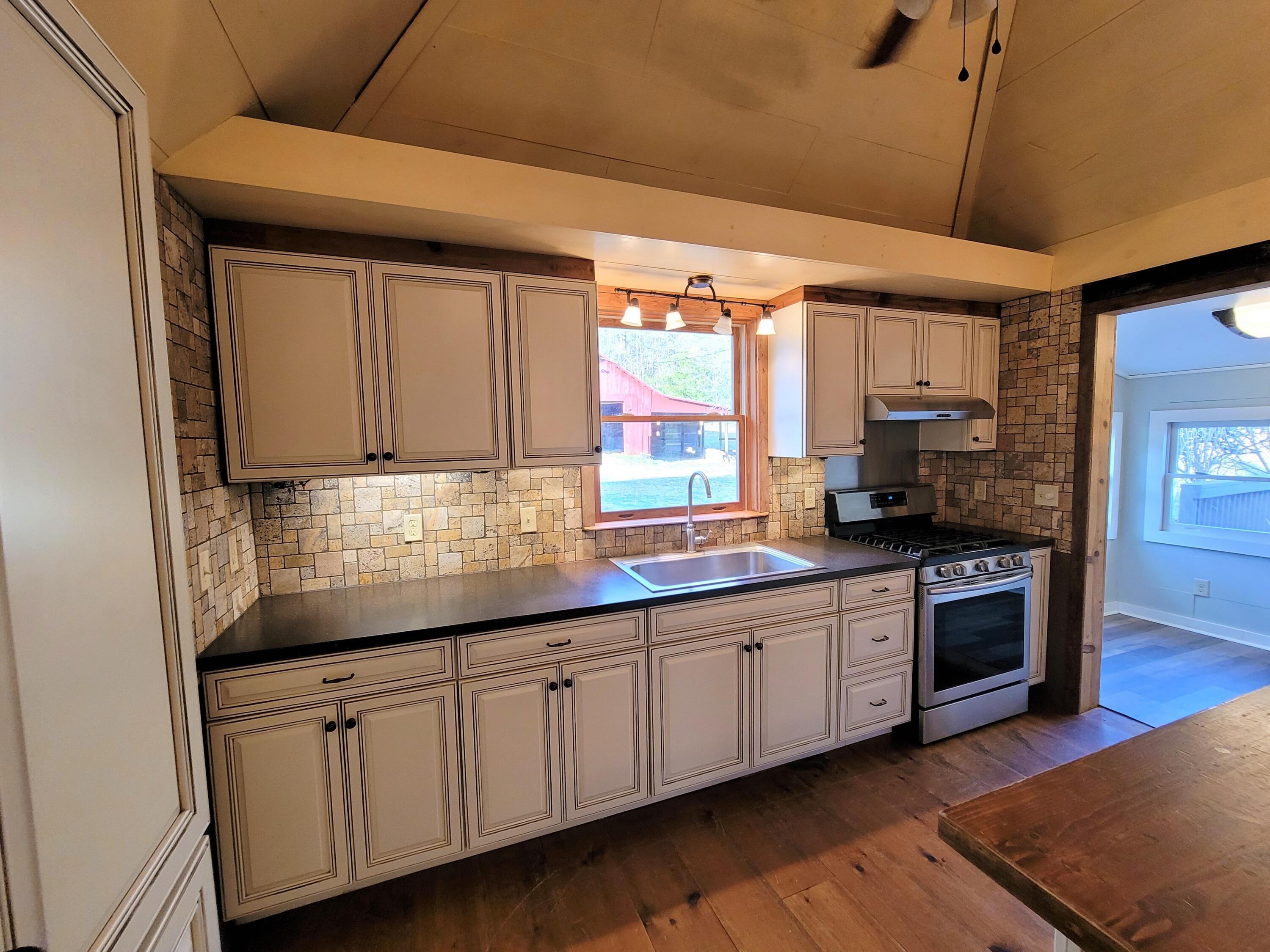 330 Green Level Road Boones Mill, VA 24065 - Photo 10 of 43 a kitchen with sink and cabinets