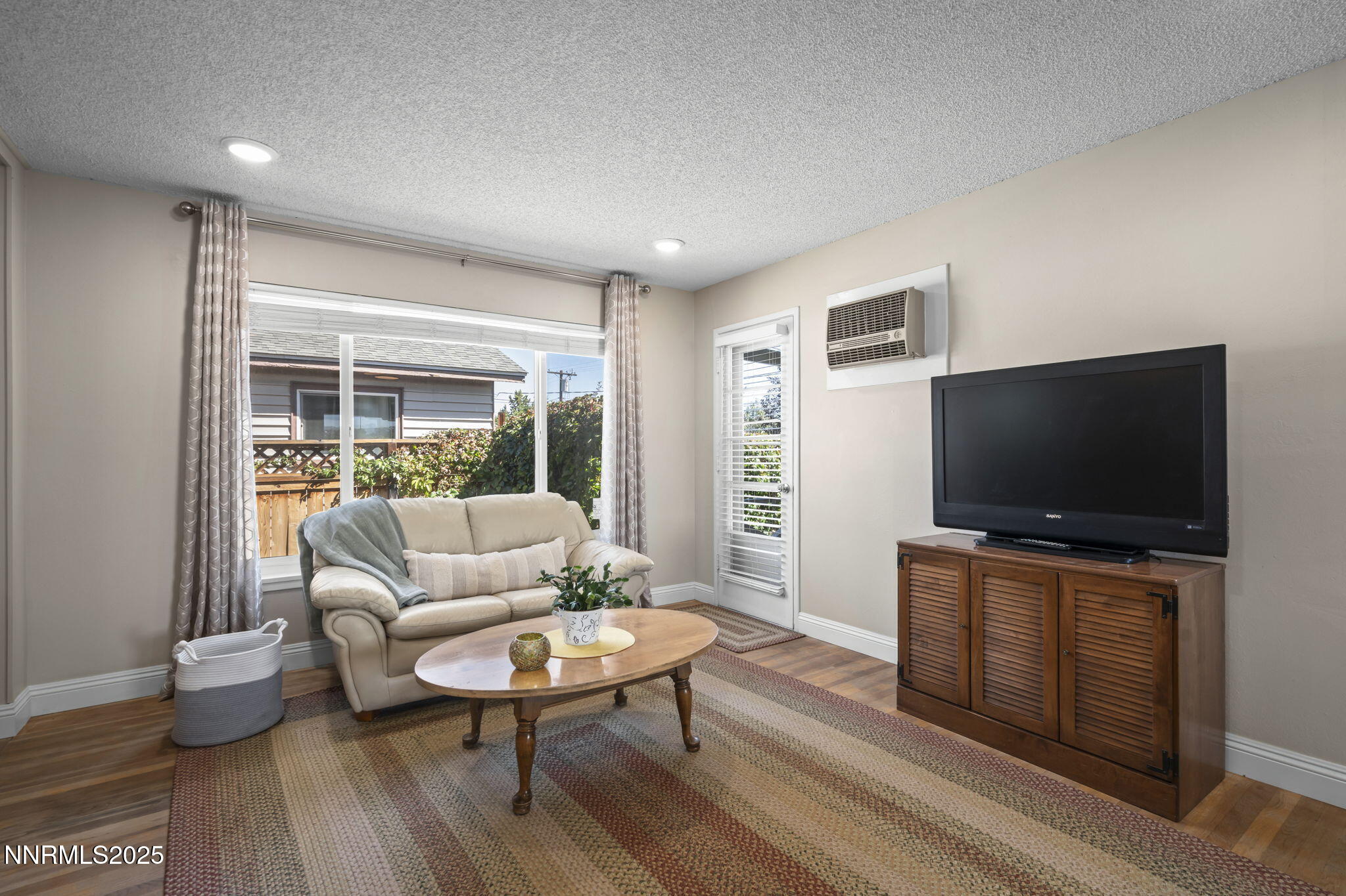 1680 Sutro Street Reno, NV 89512 - Photo 12 of 25 a living room with furniture and a flat screen tv