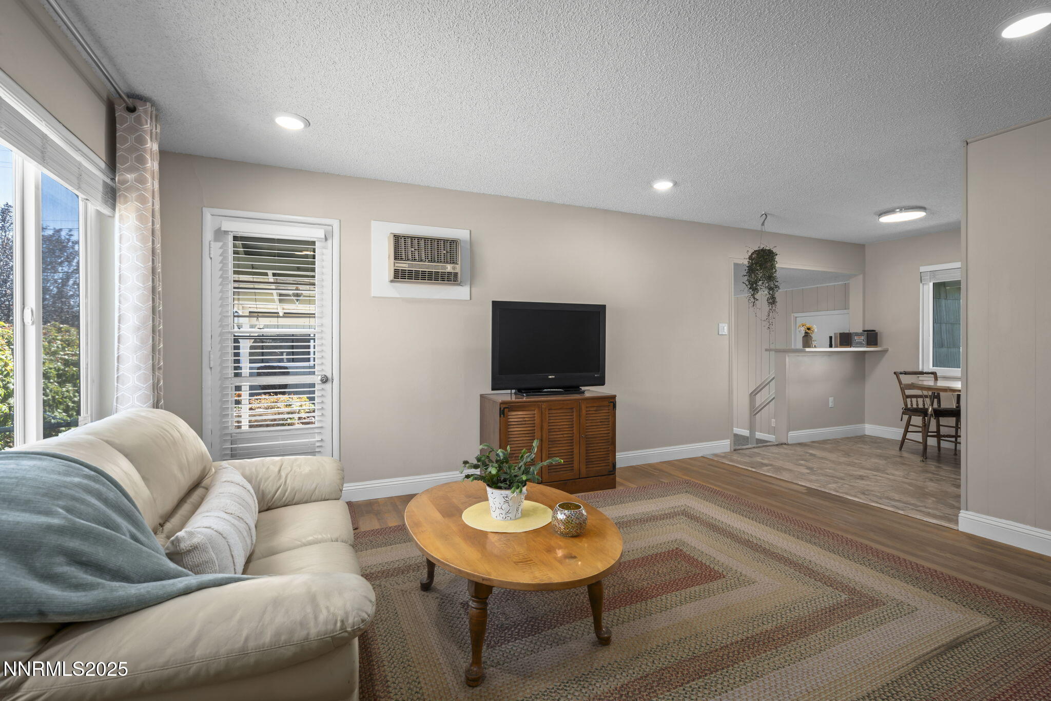 1680 Sutro Street Reno, NV 89512 - Photo 13 of 25 a living room with furniture and a flat screen tv