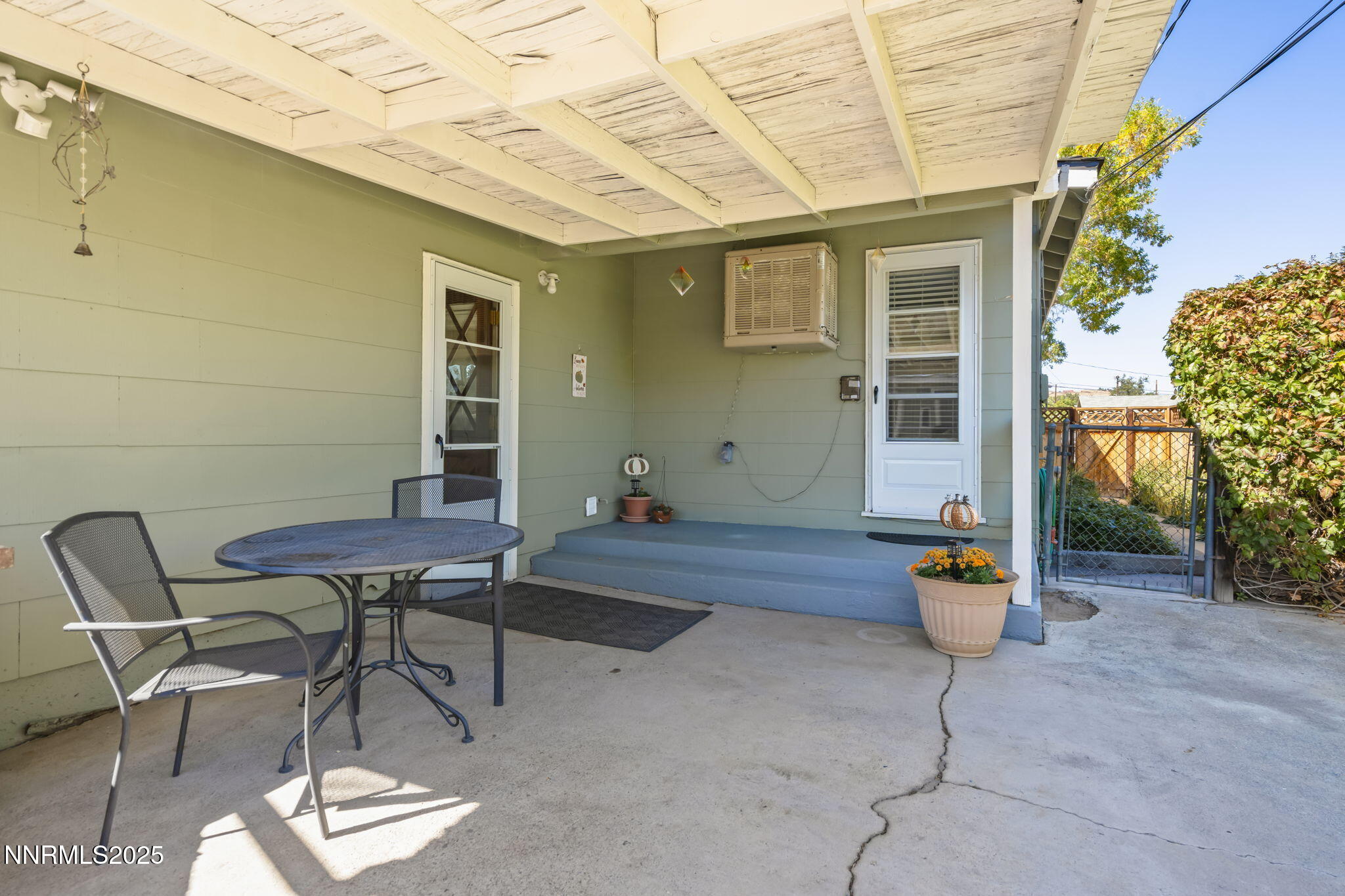 1680 Sutro Street Reno, NV 89512 - Photo 20 of 25 a view of a patio with table and chairs and potted plants
