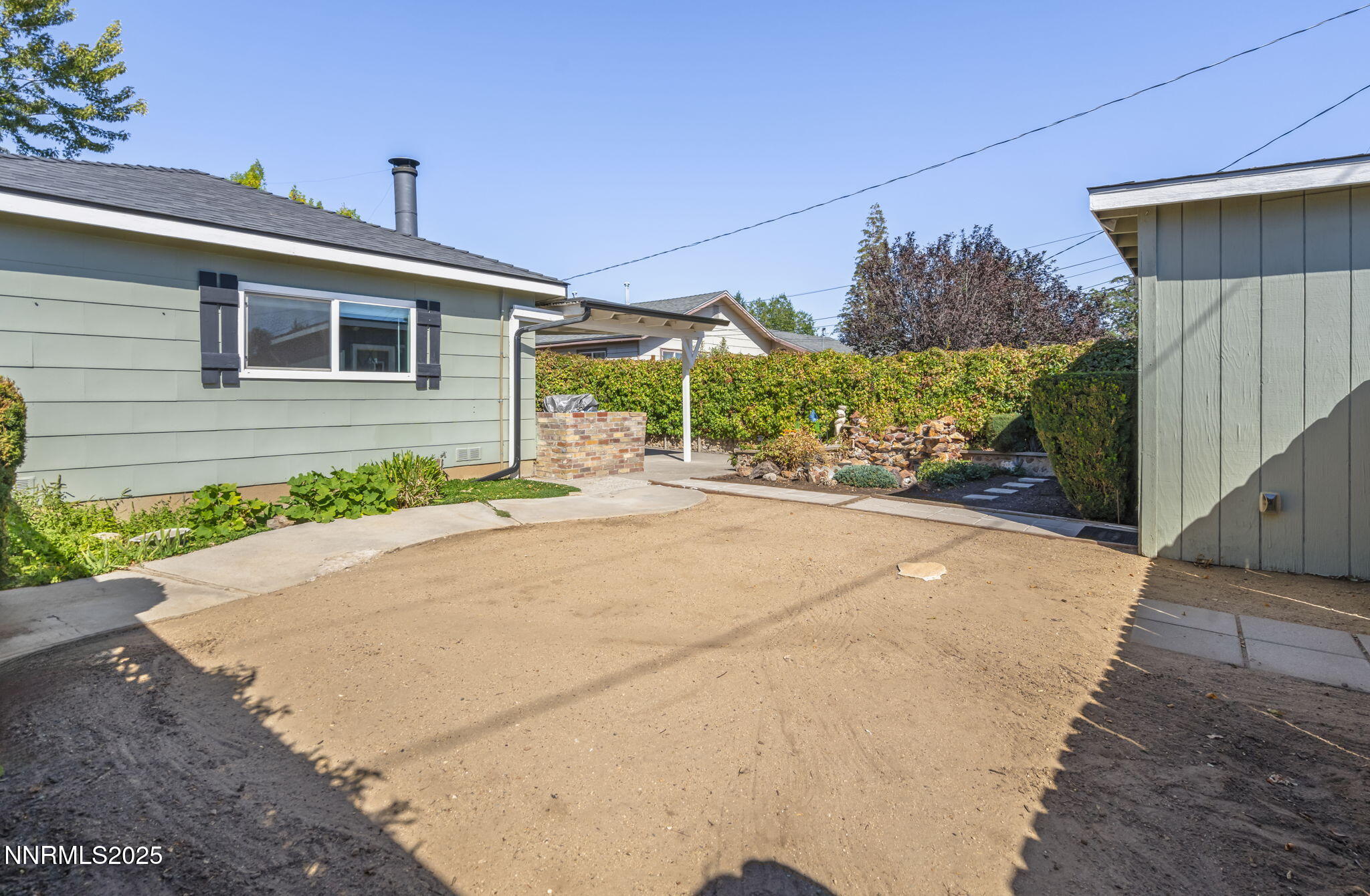 1680 Sutro Street Reno, NV 89512 - Photo 22 of 25 a front view of a house with a yard and garage