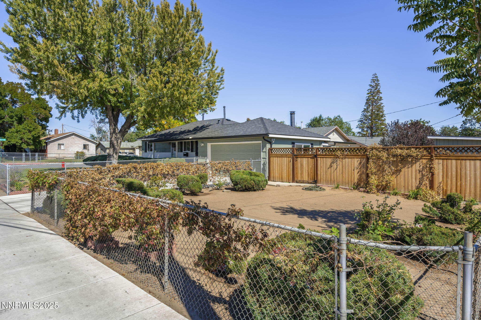 1680 Sutro Street Reno, NV 89512 - Photo 3 of 25 a front view of a house with garden