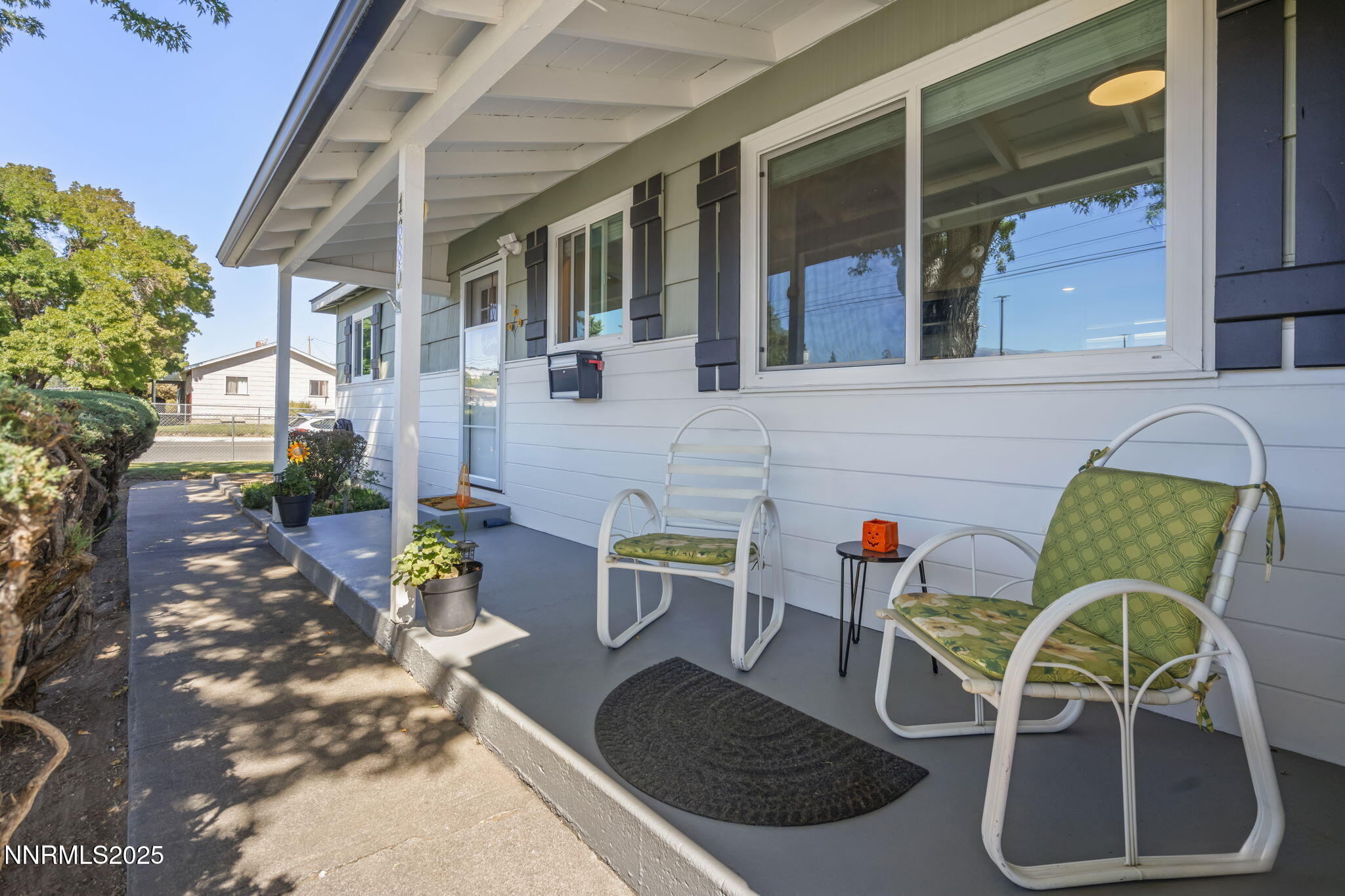 1680 Sutro Street Reno, NV 89512 - Photo 4 of 25 a view of a patio with table and chairs potted plants
