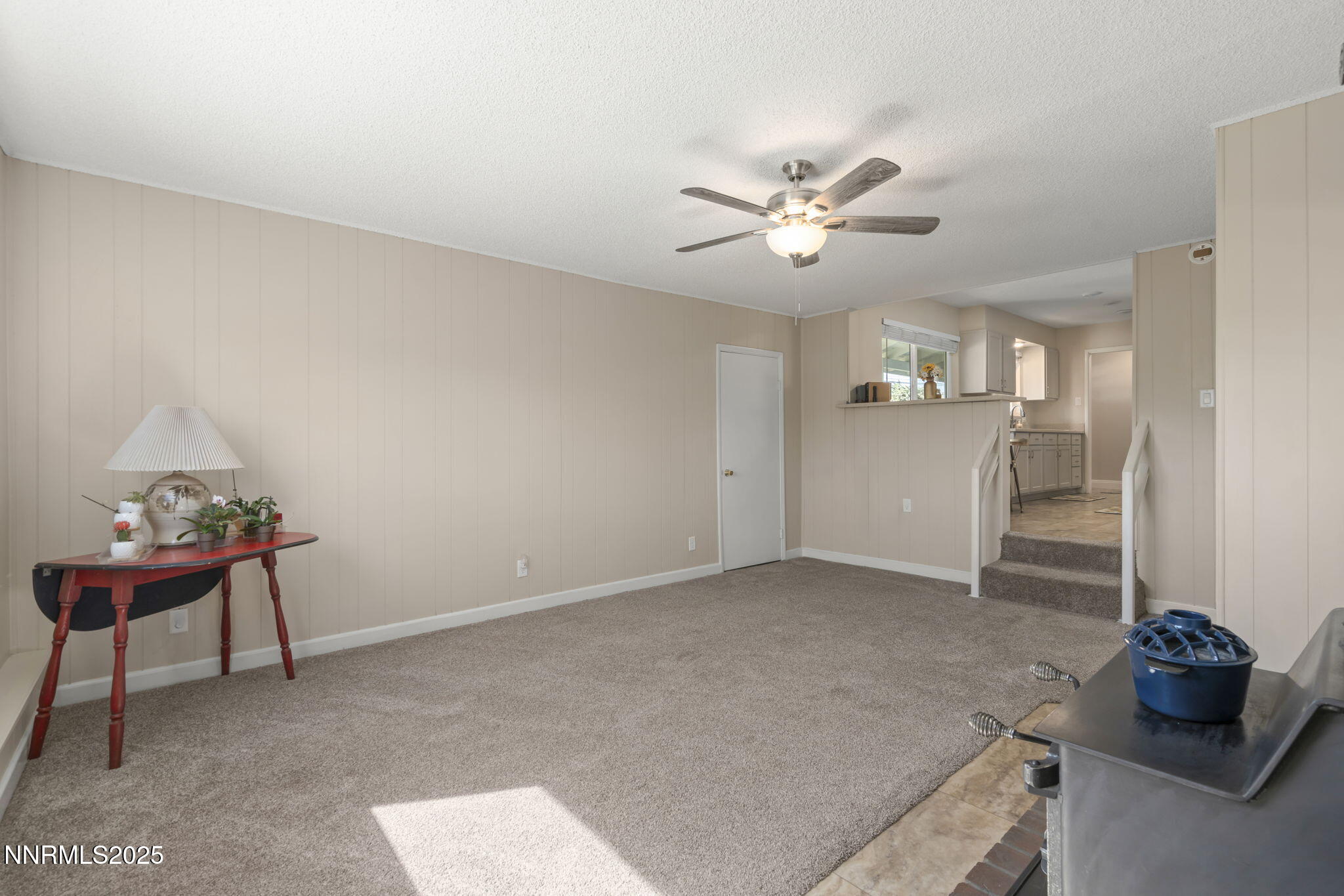1680 Sutro Street Reno, NV 89512 - Photo 10 of 25 a living room with furniture and a chandelier
