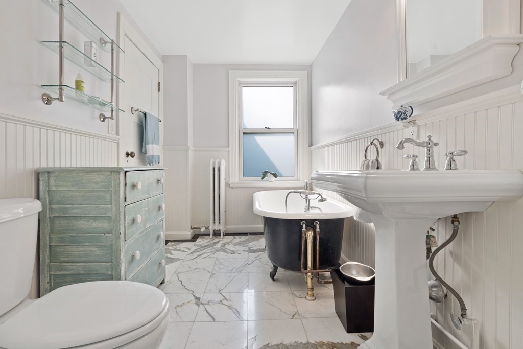 157 Winthrop Road, Unit 1 Brookline, MA 02445 - Photo 17 of 36 a bathroom with a sink a toilet and shower