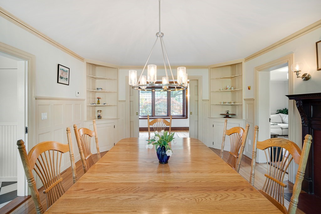 157 Winthrop Road, Unit 1 Brookline, MA 02445 - Photo 4 of 36 a dining room with furniture and a chandelier