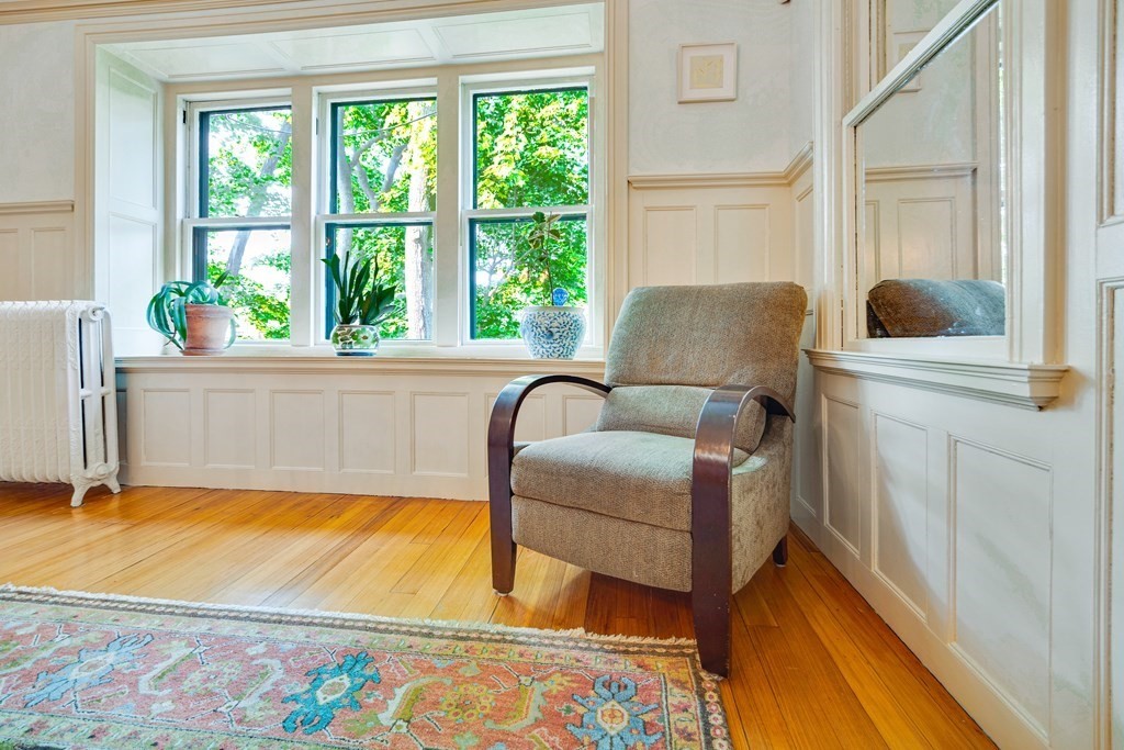 157 Winthrop Road, Unit 1 Brookline, MA 02445 - Photo 5 of 36 a living room with furniture and a large window