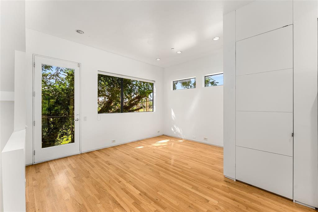 1505 North Haskell Avenue, Unit 5 Dallas, TX 75204 - Photo 11 of 40 a view of empty room with wooden floor and fan