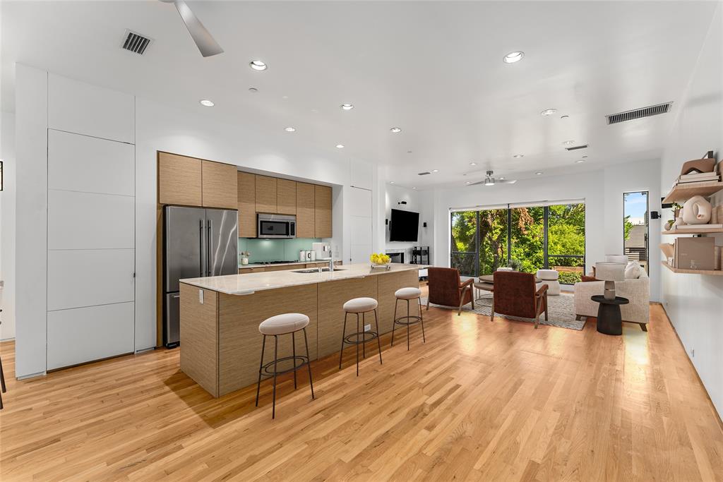 1505 North Haskell Avenue, Unit 5 Dallas, TX 75204 - Photo 12 of 40 a living room with furniture and a wooden floor