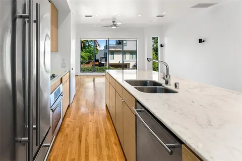 a view of a kitchen cabinets a sink and dishwasher