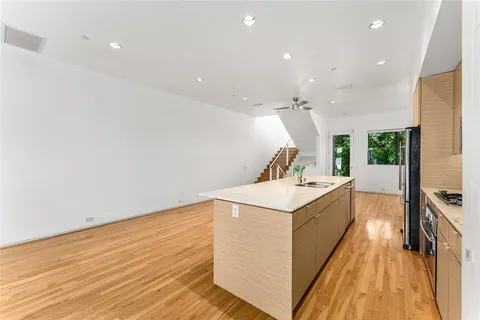 a kitchen with a sink and a stove top oven