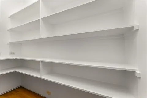 a view of an empty walk in closet