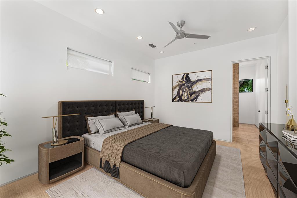 1505 North Haskell Avenue, Unit 5 Dallas, TX 75204 - Photo 19 of 40 a bedroom with bed and a chandelier