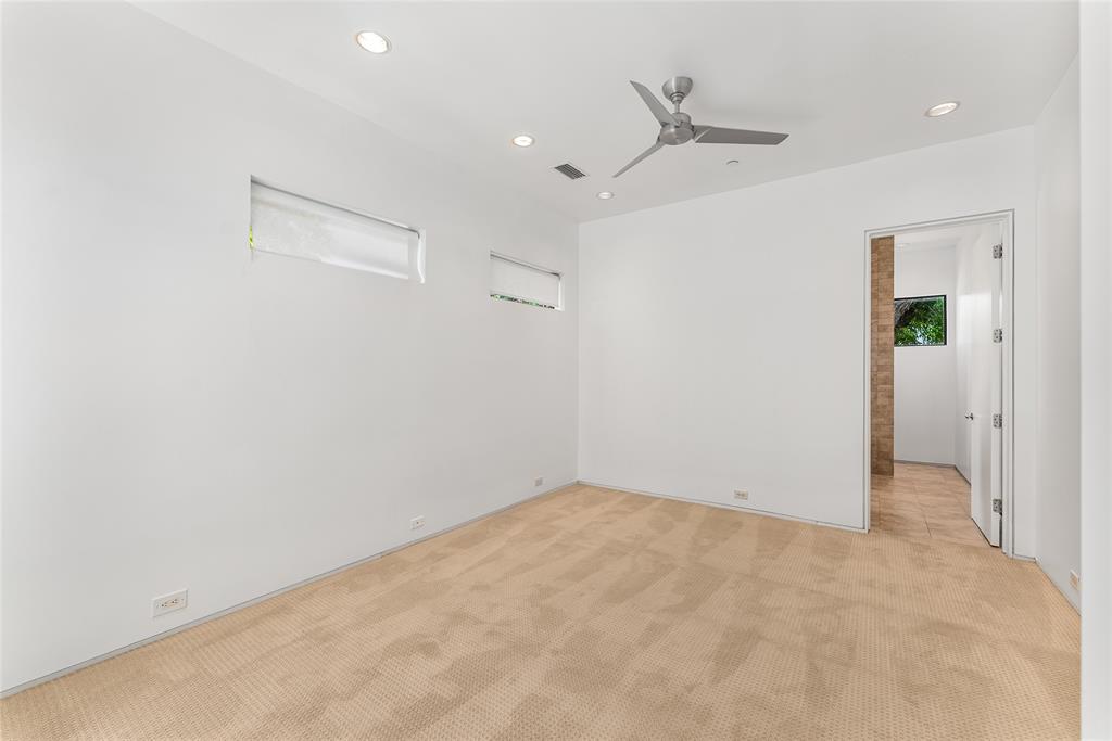 1505 North Haskell Avenue, Unit 5 Dallas, TX 75204 - Photo 20 of 40 an empty room with a ceiling fan and a window