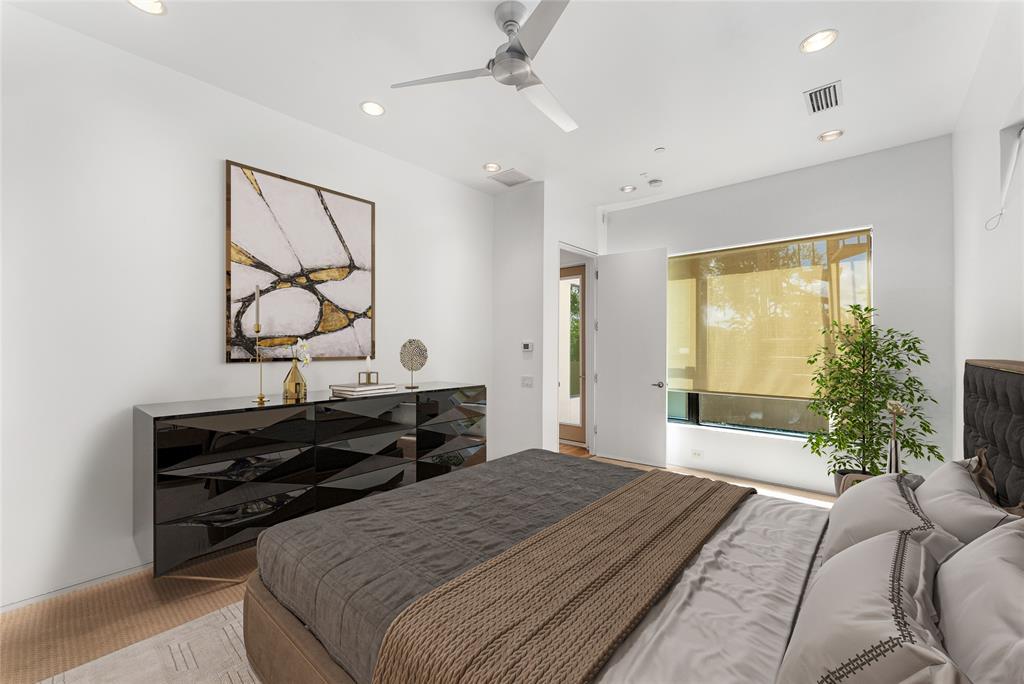 1505 North Haskell Avenue, Unit 5 Dallas, TX 75204 - Photo 21 of 40 a bedroom with a bed window and potted plant