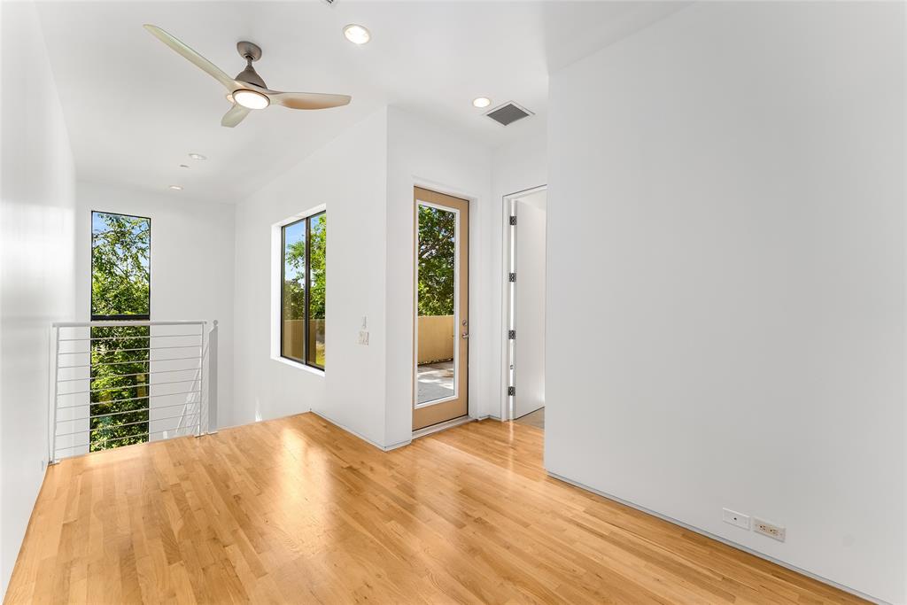 1505 North Haskell Avenue, Unit 5 Dallas, TX 75204 - Photo 30 of 40 a view of empty room with wooden floor and fan