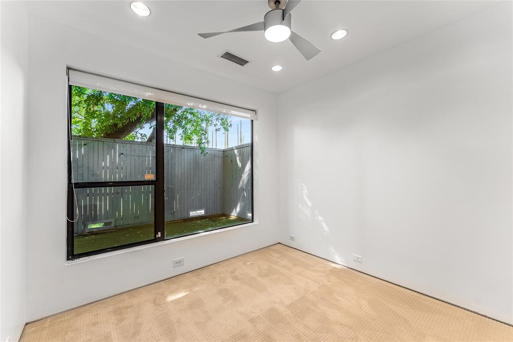 1505 North Haskell Avenue, Unit 5 Dallas, TX 75204 - Photo 33 of 40 an empty room with wooden floor and windows
