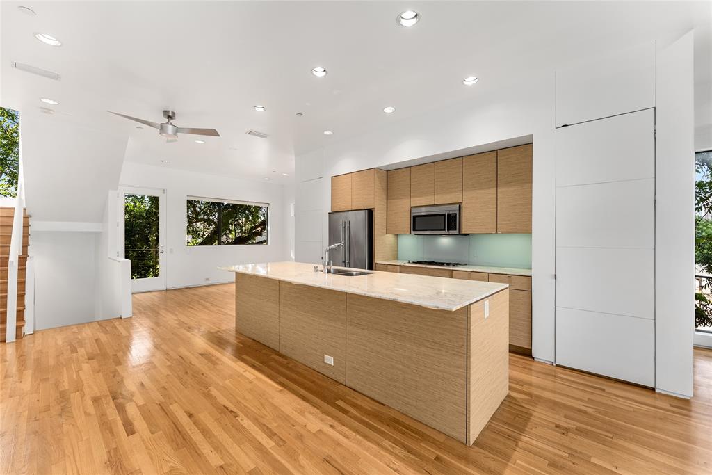 1505 North Haskell Avenue, Unit 5 Dallas, TX 75204 - Photo 9 of 40 a kitchen with stainless steel appliances granite countertop a stove and a refrigerator