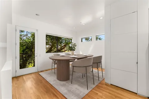a view of a dining room with furniture and window