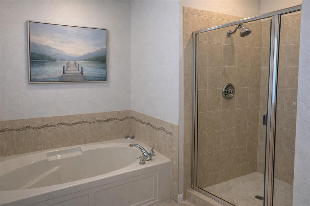 1007 Bennett Road Orlando, FL 32814 - Photo 14 of 25 a bathroom with a bathtub and shower