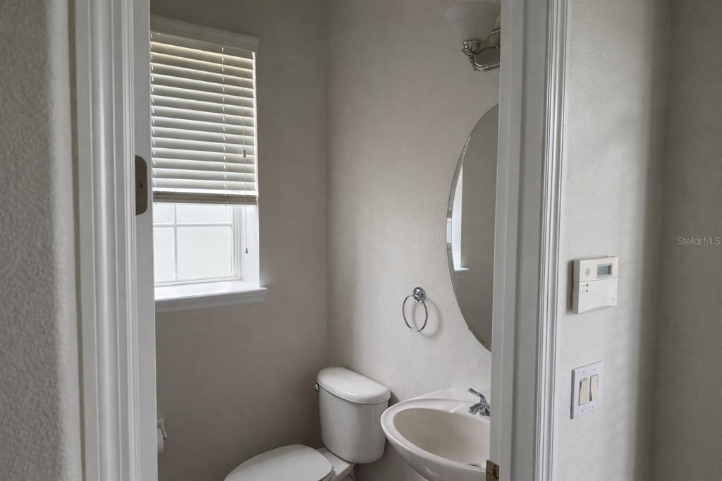 1007 Bennett Road Orlando, FL 32814 - Photo 18 of 25 a bathroom with a toilet and a sink