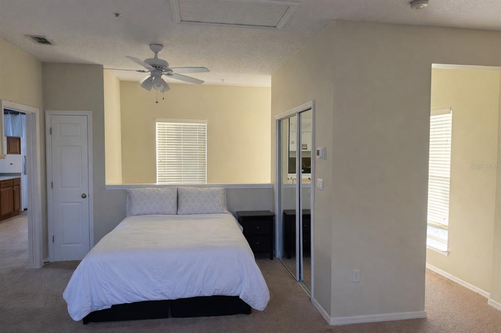 1007 Bennett Road Orlando, FL 32814 - Photo 22 of 25 a bedroom with a bed and a window
