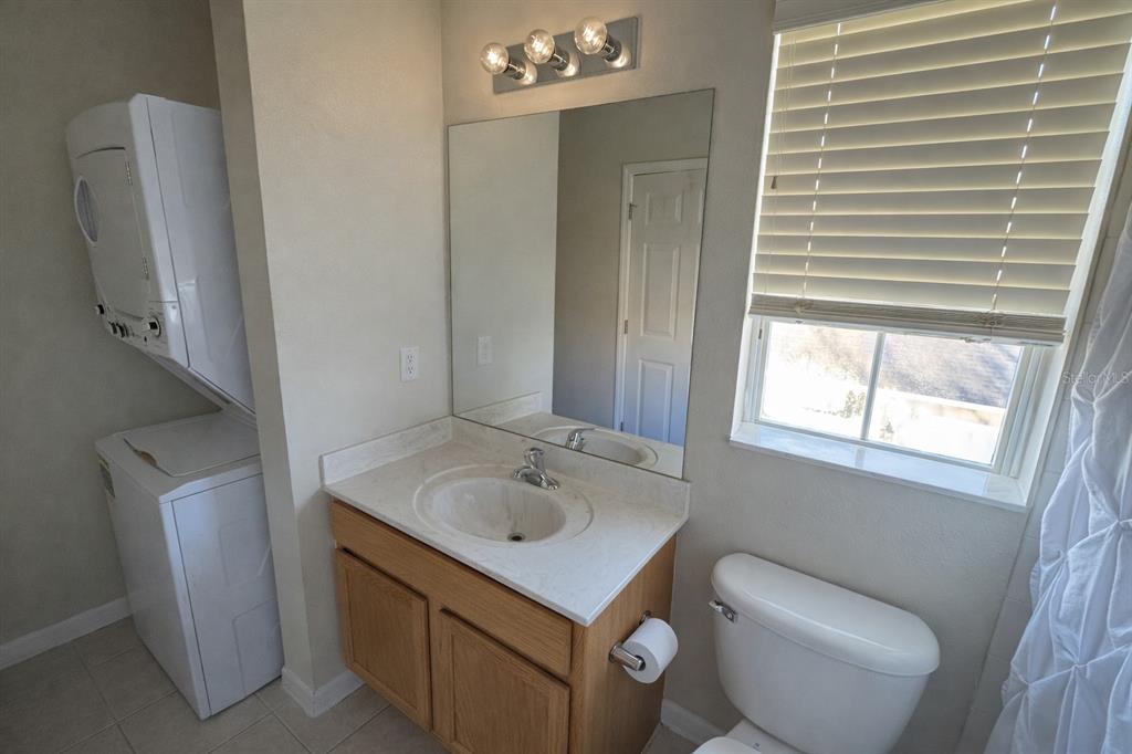 1007 Bennett Road Orlando, FL 32814 - Photo 23 of 25 a bathroom with a toilet sink and mirror