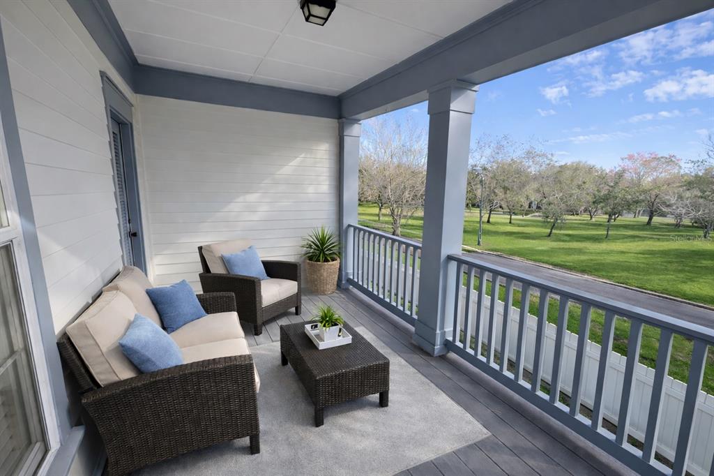 1007 Bennett Road Orlando, FL 32814 - Photo 3 of 25 a balcony with furniture and a garden