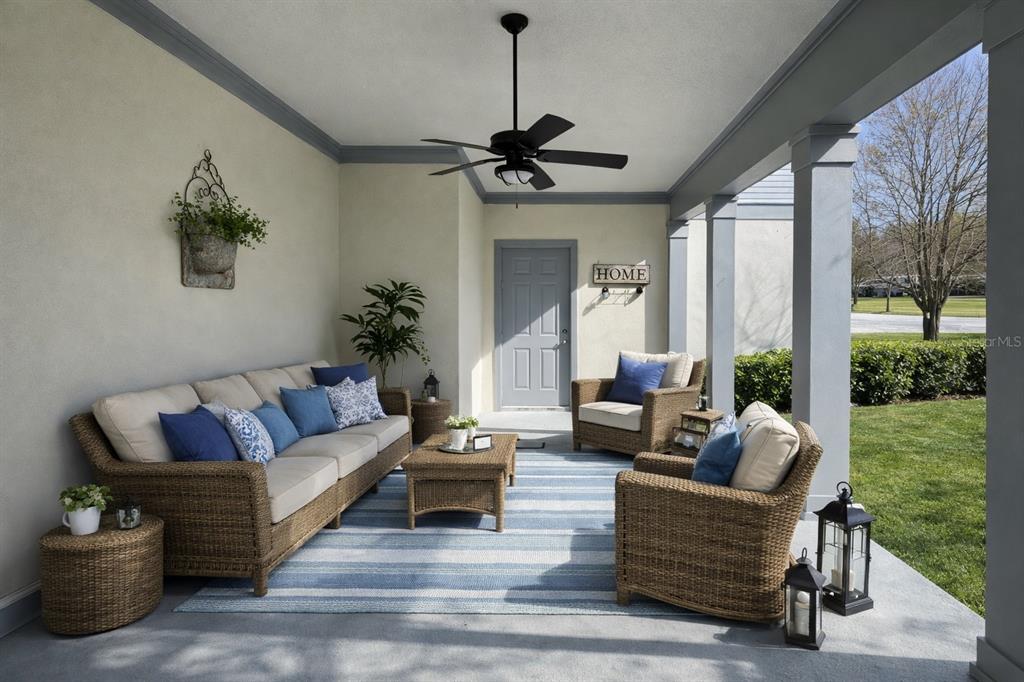 1007 Bennett Road Orlando, FL 32814 - Photo 4 of 25 a living room with patio a couch and a floor to ceiling window