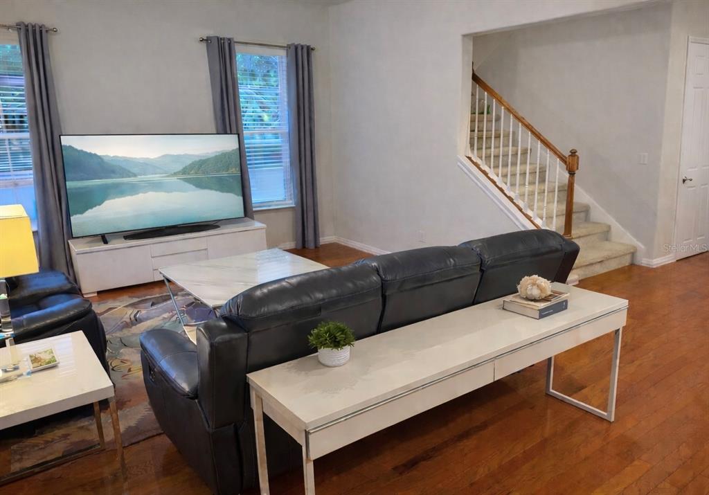 1007 Bennett Road Orlando, FL 32814 - Photo 7 of 25 a living room with furniture and a flat screen tv