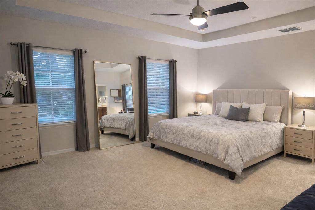 1007 Bennett Road Orlando, FL 32814 - Photo 10 of 25 a spacious bedroom with a bed and a walk in closet