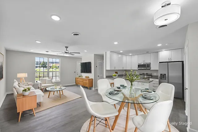 a view of a dining room with furniture window and wooden floor