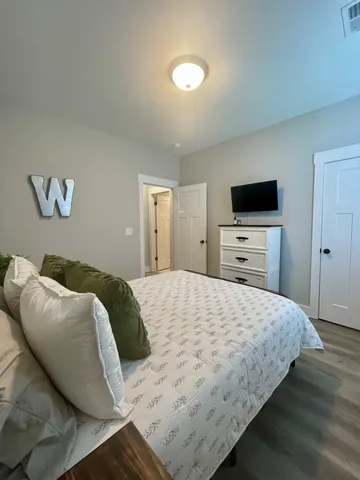 a bedroom with a bed and a cabinets
