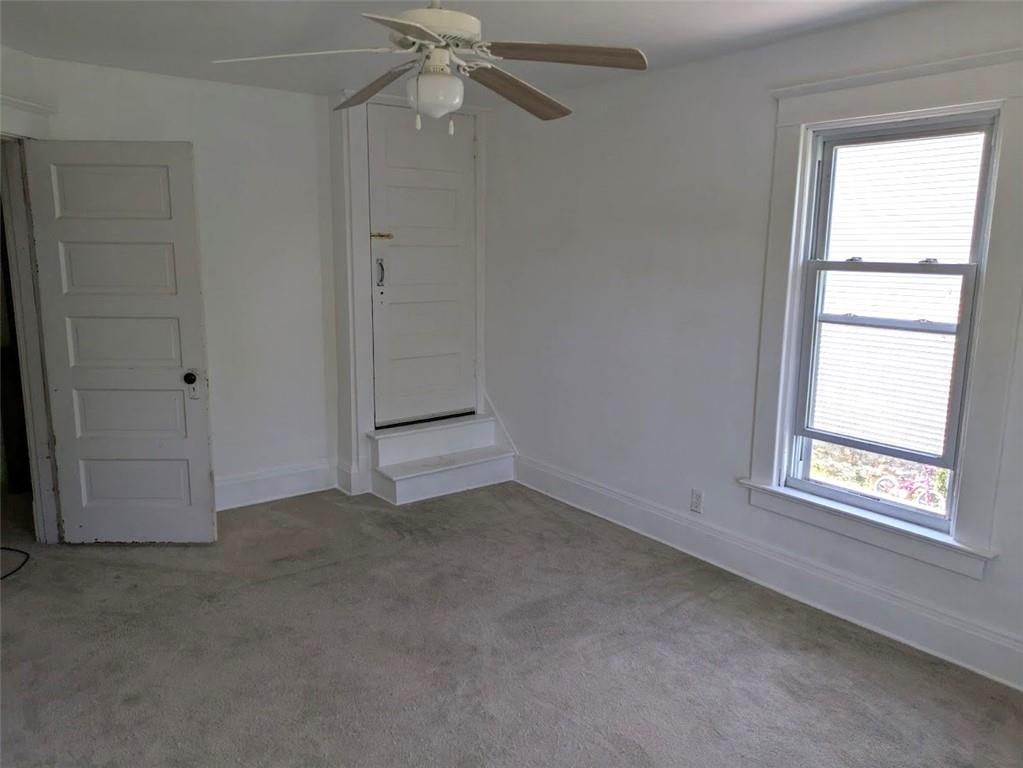 413 North 3rd Street Jeannette, PA 15644 - Photo 21 of 38 an empty room with windows and fan